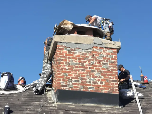 Lancaster Chimney Sweep installing a custom chimney crown in Lancaster, OH