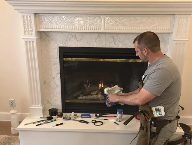 Lancaster Chimney Sweep performing fireplace maintenance in Lancaster, OH