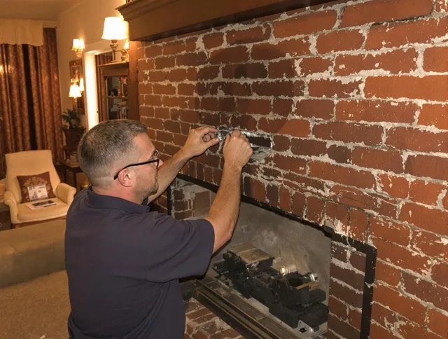 Lancaster Chimney Sweep expert fixing a fireplace in Lancaster, OH